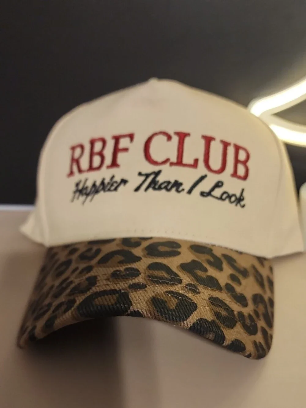 Cream and Leopard Print Baseball Cap with Embroidered Slogan